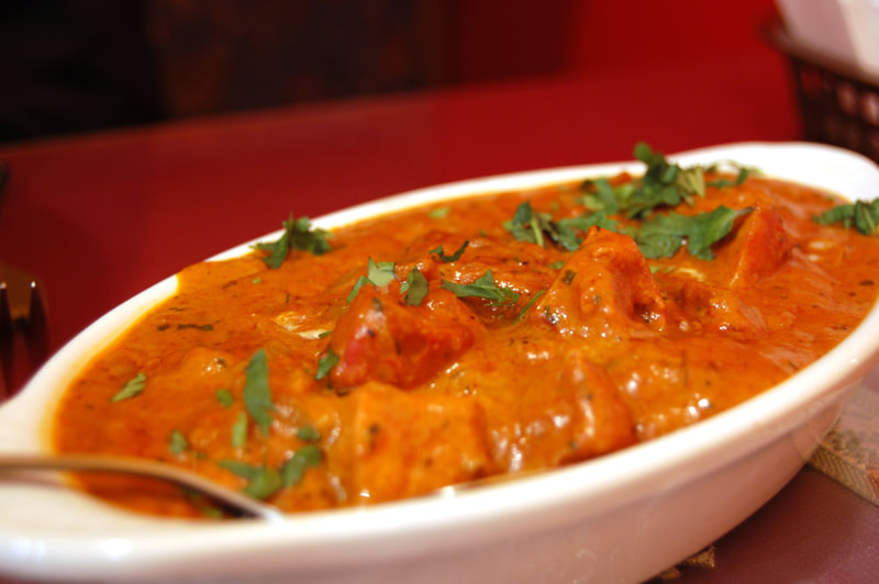 Chicken tikka cooked in the traditional way with tomatoes, herbs, cream and butter